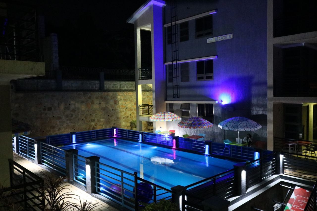 Denver Elysium pool and skyline illuminated at night